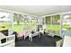 Cozy sunroom featuring wicker furniture and ample natural light at 9098 W 1050 N, Elwood, IN 46036