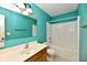 Well-lit bathroom with white sink and a shower-over-tub combo at 924 S B St, Elwood, IN 46036