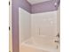 Bathroom featuring a white shower tub surrounded by light purple walls at 924 S B St, Elwood, IN 46036