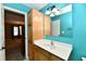 Bright bathroom features a stylish vanity with a white countertop and ample storage space at 924 S B St, Elwood, IN 46036