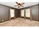 Bedroom featuring carpeted floors, neutral walls, a ceiling fan and windows at 924 S B St, Elwood, IN 46036
