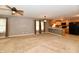 Open-concept living room with carpet flows into the kitchen, boasting natural light and a ceiling fan at 924 S B St, Elwood, IN 46036