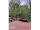 Spacious, stained back deck with built-in benches and backyard access at 9650 Copley Dr, Carmel, IN 46290