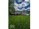 View of the expansive backyard and multi-level back deck, perfect for outdoor entertaining at 9650 Copley Dr, Carmel, IN 46290
