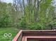 View of the peaceful backyard with natural landscaping and wooded area at 9650 Copley Dr, Carmel, IN 46290
