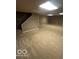 Spacious basement with neutral carpet, painted walls, and recessed lighting, offering versatile living space at 9650 Copley Dr, Carmel, IN 46290