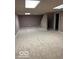 Expansive basement featuring neutral carpet and a staircase, providing a flexible space for various uses at 9650 Copley Dr, Carmel, IN 46290