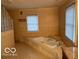 Spacious bathroom featuring large soaking tub and glass block shower at 9650 Copley Dr, Carmel, IN 46290
