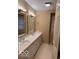 Bright bathroom features a double sink vanity, large mirrors, and modern fixtures for a comfortable and stylish space at 9650 Copley Dr, Carmel, IN 46290