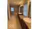 Bright primary bathroom with double sink vanity, soaking tub, and large mirrors at 9650 Copley Dr, Carmel, IN 46290