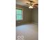 Bedroom features gray walls, carpet, and a window at 9650 Copley Dr, Carmel, IN 46290