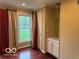 Bedroom features hardwood floors, a window, and built in storage at 9650 Copley Dr, Carmel, IN 46290