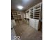 Spacious walk-in closet with custom shelving and drawers at 9650 Copley Dr, Carmel, IN 46290