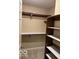An empty closet with shelves ready for new owners at 9650 Copley Dr, Carmel, IN 46290