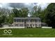 Charming two-story home with large front yard and mature trees at 9650 Copley Dr, Carmel, IN 46290