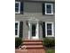 Inviting front entrance with brick steps and classic white trim at 9650 Copley Dr, Carmel, IN 46290