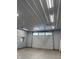 Functional garage interior with a large roll-up door and ample lighting, providing secure parking and workspace at 9650 Copley Dr, Carmel, IN 46290