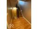 Hallway features hardwood floors and stairway at 9650 Copley Dr, Carmel, IN 46290