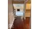 Hallway view features hardwood flooring, striped wall paper, and built in cabinetry at 9650 Copley Dr, Carmel, IN 46290