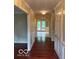 Elegant hallway with hardwood floors and detailed trim at 9650 Copley Dr, Carmel, IN 46290