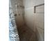 Tiled shower features glass block and handheld shower head at 9650 Copley Dr, Carmel, IN 46290