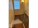 Carpeted staircase with wood railings leading to the upper level at 9650 Copley Dr, Carmel, IN 46290