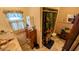 Functional bathroom with a shower, vanity with storage, and a window providing natural light at 100 N 6Th Ave, Beech Grove, IN 46107