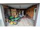 Spacious garage with ample storage and room for equipment, including a ride-on lawnmower at 100 N 6Th Ave, Beech Grove, IN 46107