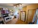 Functional kitchen with gas range, white refrigerator, and an eat-in area at 100 N 6Th Ave, Beech Grove, IN 46107