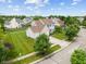 Aerial view showcasing the home's exterior, driveway, and surrounding landscaping at 1029 Bridgeport Dr, Westfield, IN 46074
