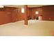 Spacious finished basement with neutral carpet and brown walls, ideal for recreation or storage at 1029 Bridgeport Dr, Westfield, IN 46074