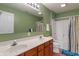 Bathroom with double vanity, large mirror, and shower-tub combination at 1029 Bridgeport Dr, Westfield, IN 46074