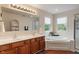 Bright bathroom featuring a soaking tub, shower, and dual sink vanity at 1029 Bridgeport Dr, Westfield, IN 46074