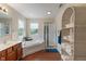 Bright bathroom featuring a soaking tub, shower, and dual sink vanity at 1029 Bridgeport Dr, Westfield, IN 46074
