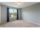Well-lit bedroom featuring a large window and neutral carpet at 1029 Bridgeport Dr, Westfield, IN 46074