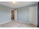 Carpeted bedroom with neutral walls, offering a calm and inviting space at 1029 Bridgeport Dr, Westfield, IN 46074