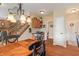 Dining area with elegant chandelier, hardwood floors, and staircase access at 1029 Bridgeport Dr, Westfield, IN 46074