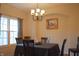 Dining room featuring a chandelier, large windows, and a table with six chairs at 1029 Bridgeport Dr, Westfield, IN 46074