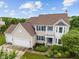 Aerial view displaying home's exterior, landscaping, and a three-car garage at 1029 Bridgeport Dr, Westfield, IN 46074