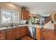 Kitchen featuring wooden cabinets, stainless steel appliances, and hardwood floors at 1029 Bridgeport Dr, Westfield, IN 46074