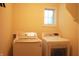 Bright laundry room features a washer and dryer, plus a window at 1029 Bridgeport Dr, Westfield, IN 46074