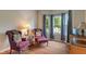Cozy living room features comfortable seating, a bay window, and hardwood flooring at 1029 Bridgeport Dr, Westfield, IN 46074
