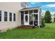 Rear view of a screened patio with a grill on the lawn at 1029 Bridgeport Dr, Westfield, IN 46074