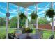 Cozy screened-in porch with a seating area, hanging plants, and views of the backyard at 1029 Bridgeport Dr, Westfield, IN 46074