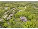 Overhead view of property with long driveway, pool, and lush green landscaping at 10627 Indian Lake S Blvd, Indianapolis, IN 46236