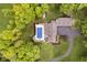 Birds eye view of home with backyard pool, patio and lush green landscaping at 10627 Indian Lake S Blvd, Indianapolis, IN 46236