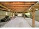 Unfinished basement with gravel, support beams, concrete walls and utilities at 10627 Indian Lake S Blvd, Indianapolis, IN 46236