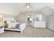 Neutral bedroom with connecting room, dresser with vanity, plush carpet, and ceiling fan at 10627 Indian Lake S Blvd, Indianapolis, IN 46236