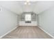 Spacious room with built-in shelving and window seat, with gray paint and neutral carpet at 10627 Indian Lake S Blvd, Indianapolis, IN 46236