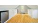 Bonus room with hardwood floors, built-in cabinets, and a mini-fridge at 10627 Indian Lake S Blvd, Indianapolis, IN 46236